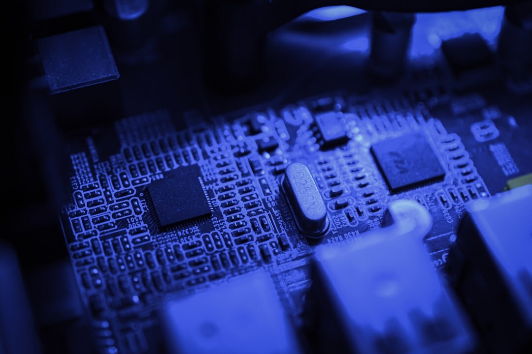 Electronic circuit board with glowing blue LED components and copper traces